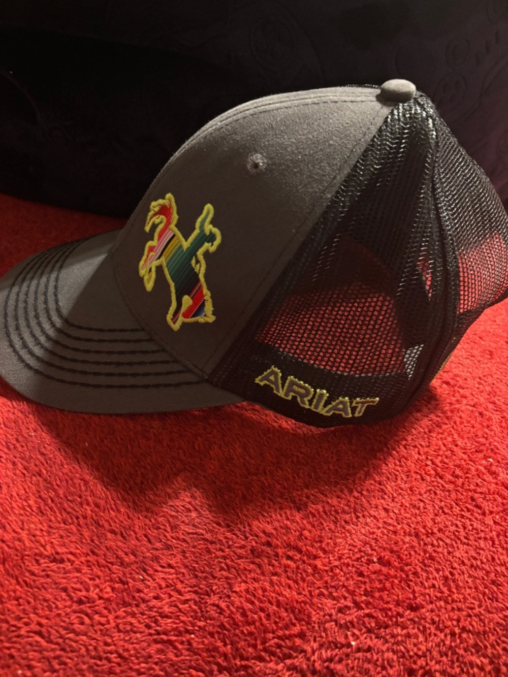 Ariat Black Trucker Cap with Multicolor Horse Patch And Ariat name logo . New